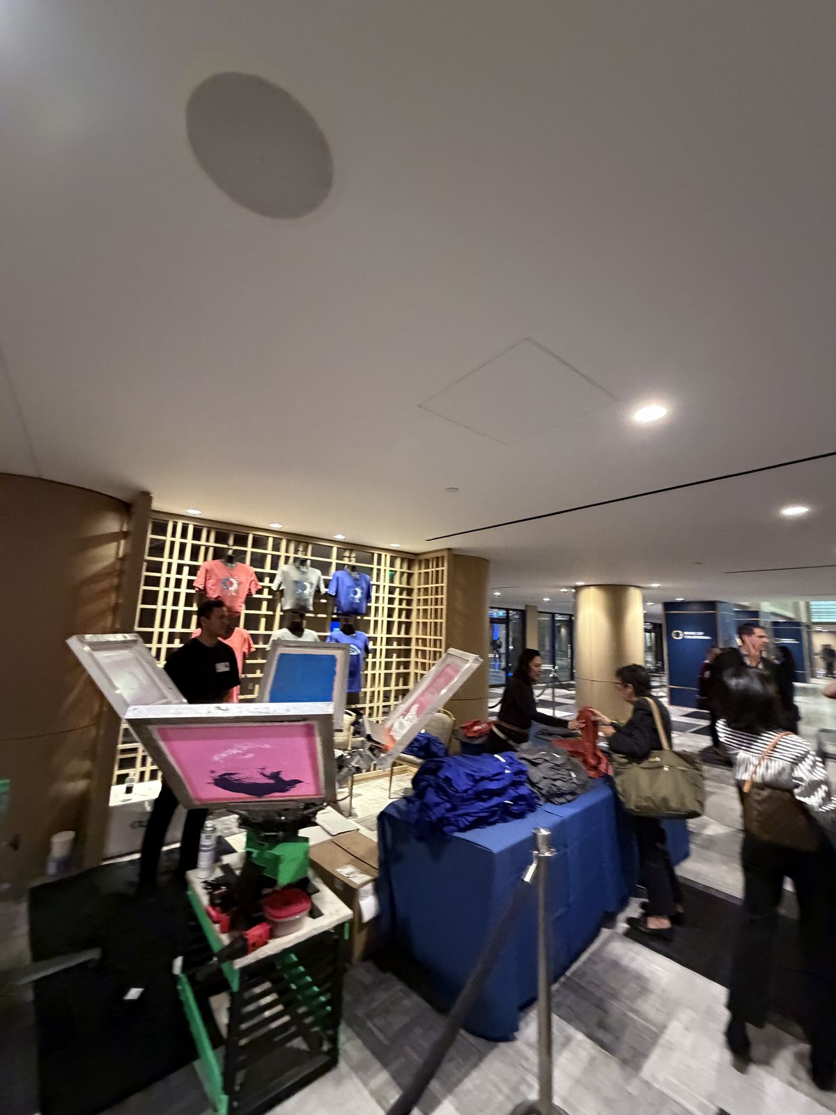 Guests watching custom merch get printed live at a Oklahoma City event